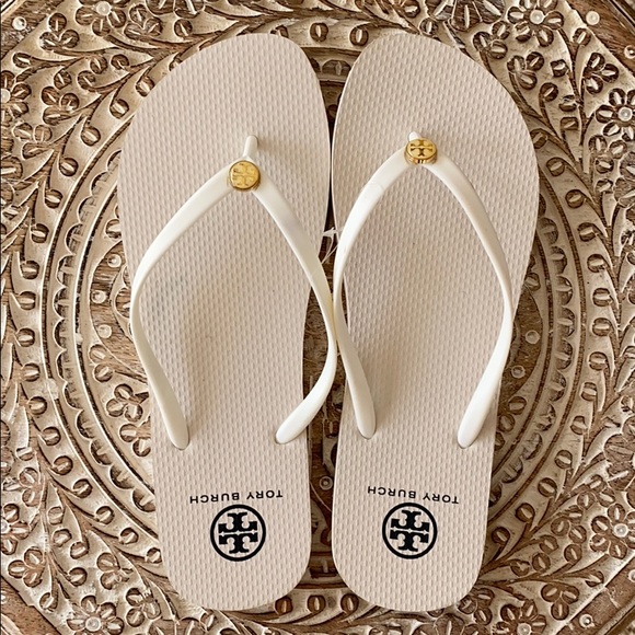 white and gold flip flops
